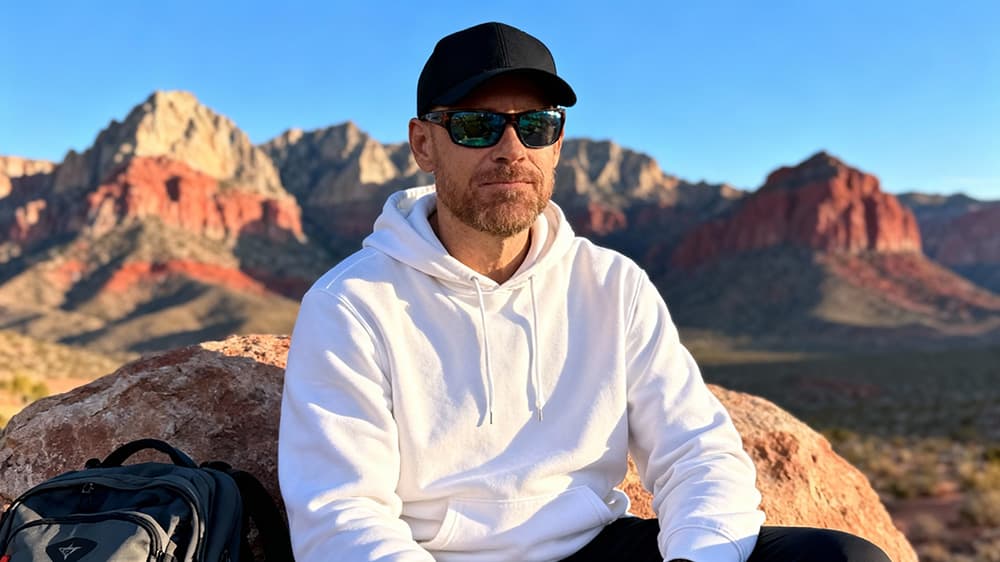 Joel Longie hiking outdoors, demonstrating work-life balance and creative thinking